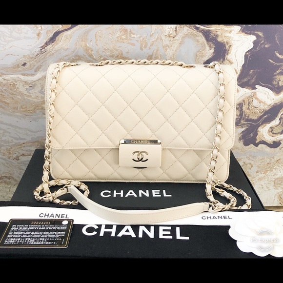 CHANEL Handbags - Sold Chanel Beauty Lock Ivory Flap Calfskin Bag